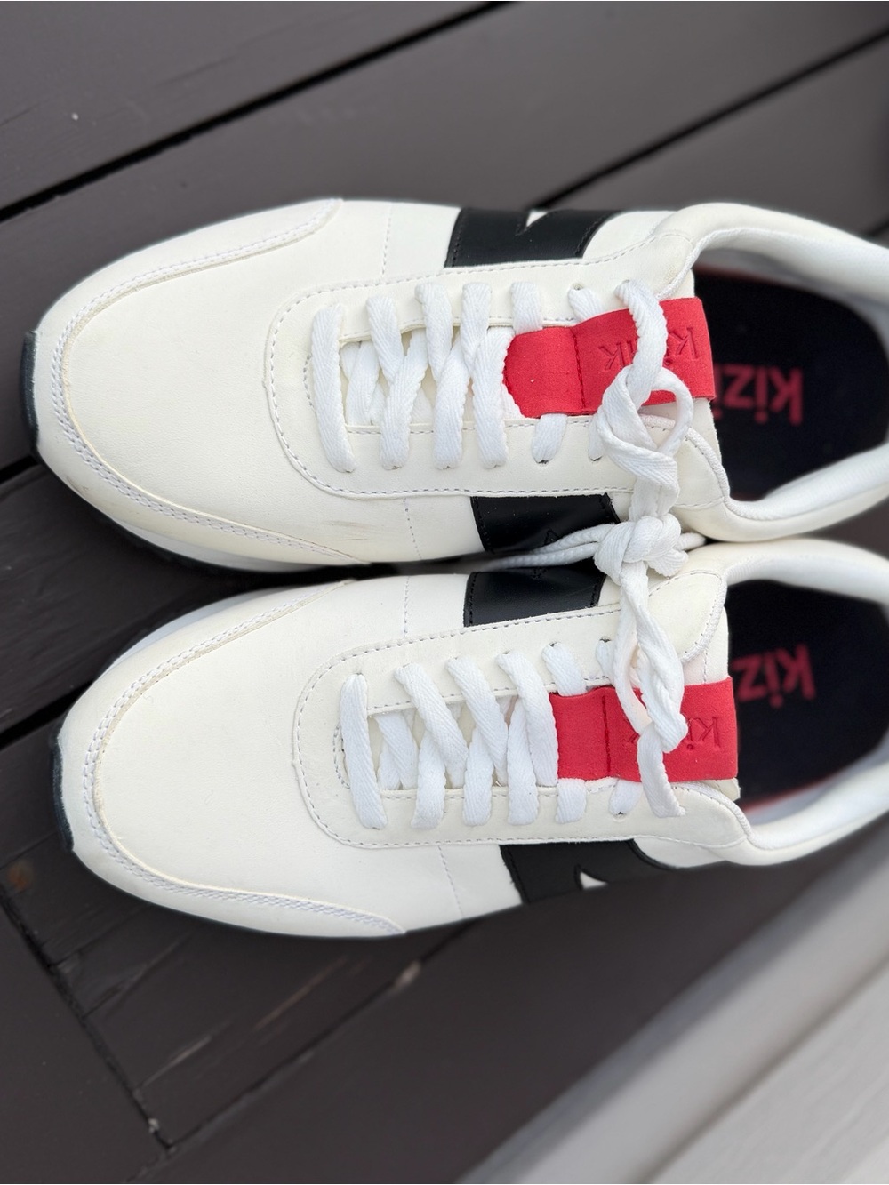 Kizik Women's White Athletic Sneakers with Black Stripes and Red Tongue Accent